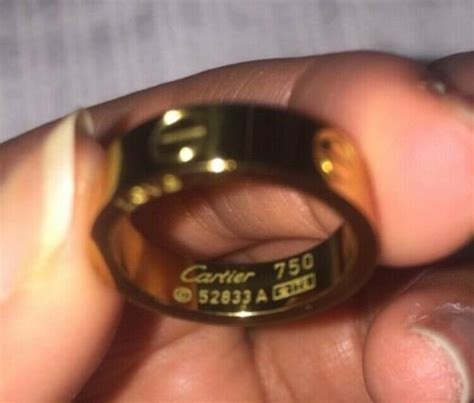 Cartier 750 ring 52833a real or fake